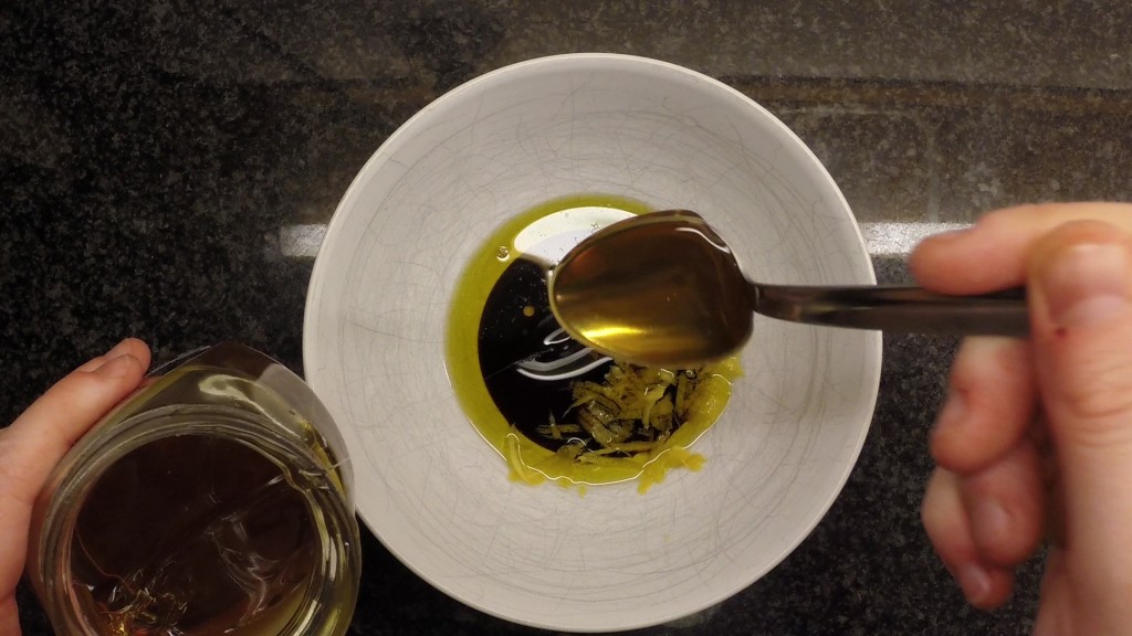 adding honey to salad dressing