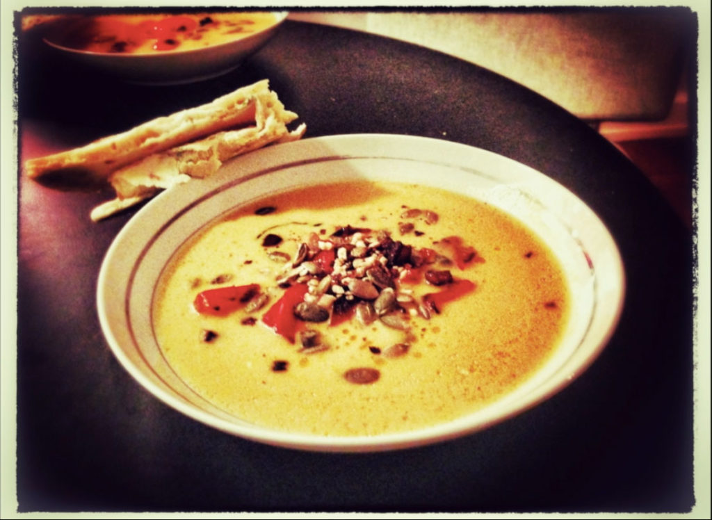 Butternut squash soup with bell pepper topping
