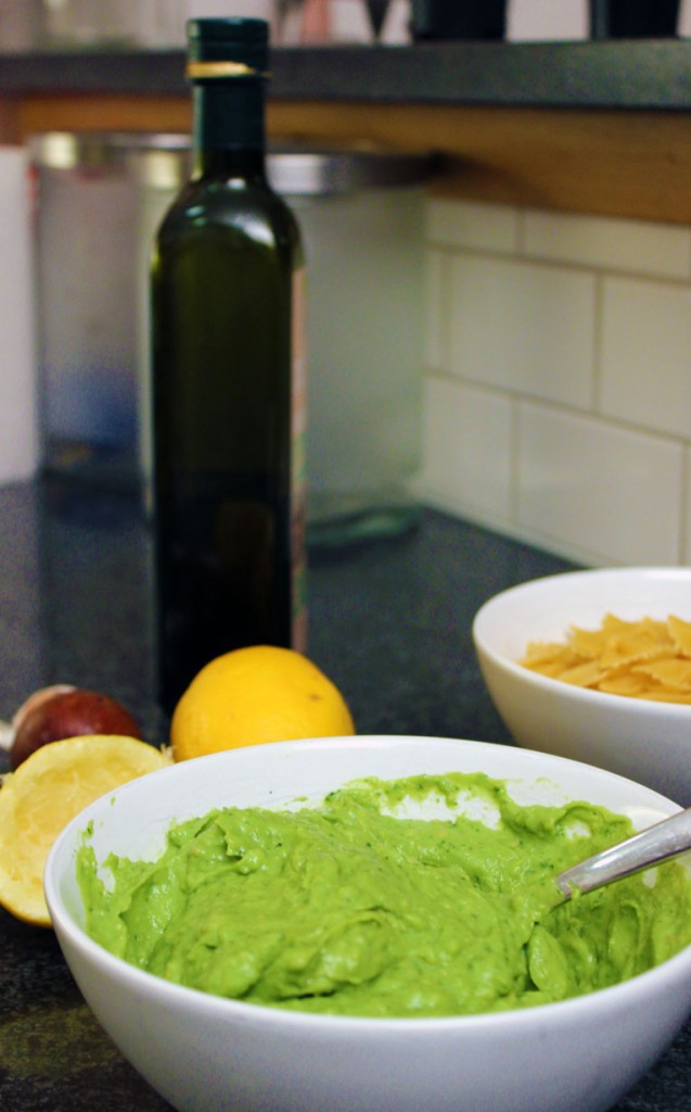 bowl of guacamole with ingredients