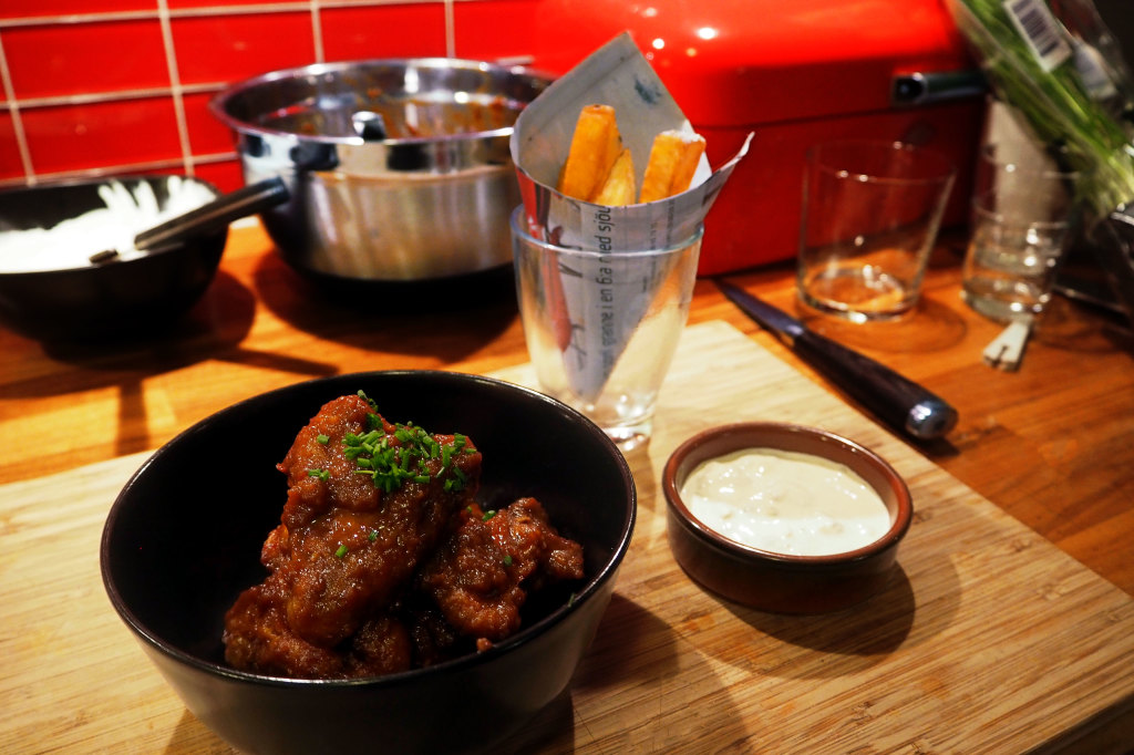 Orange barbecue chicken wings with home made fries