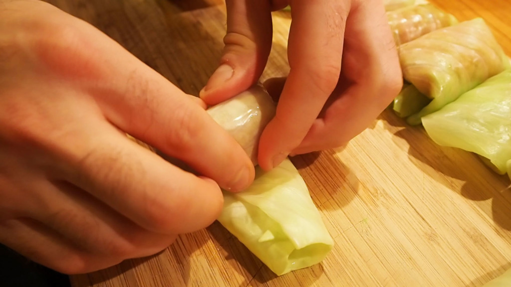 Rolling ground meat into cabbage leaves