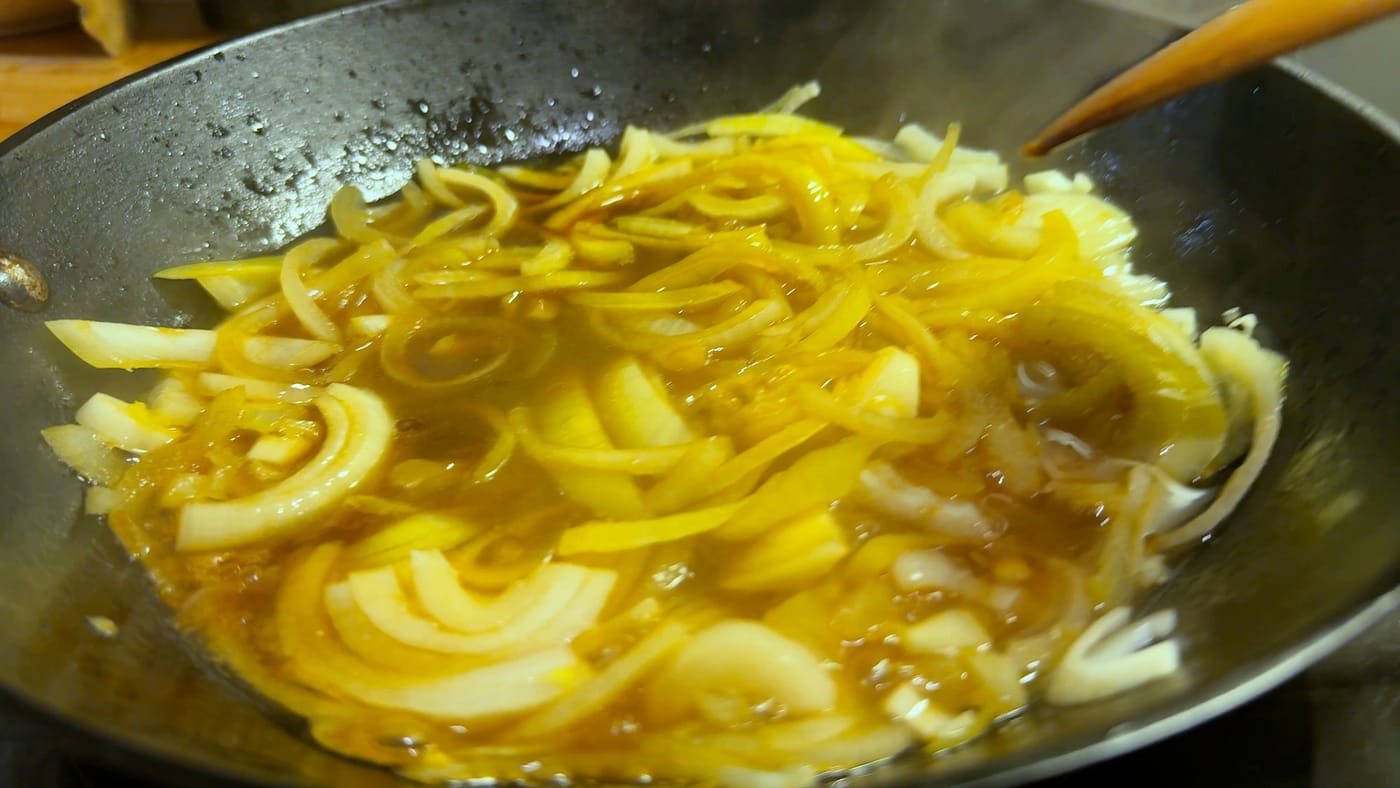 The onion simmering in the soy and sake sauce