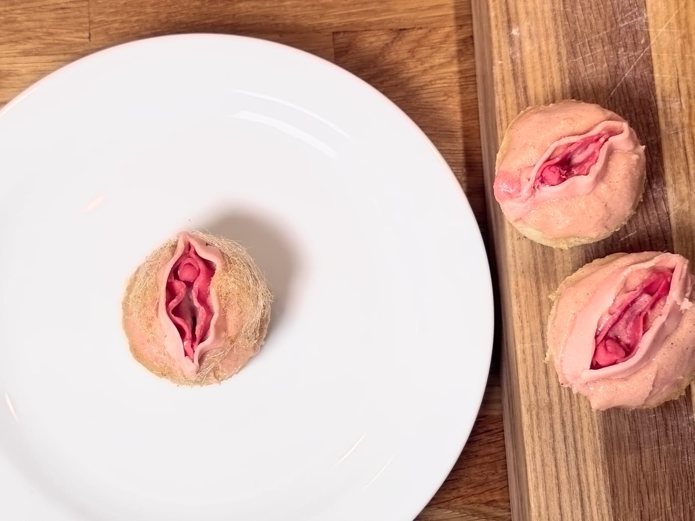 Three vulva cupcakes with labia in different sizes